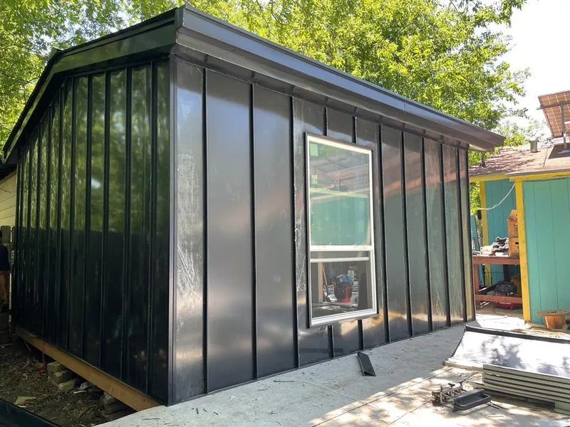 Black standing seam metal wall panels for Metal Roof Installation in North Merritt Island