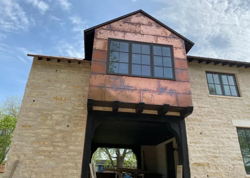 Copper metal panel facade on a stone building for Roof Repair in North Merritt Island