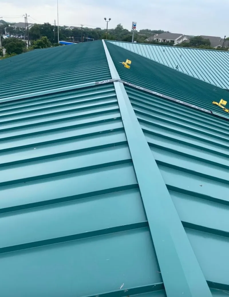 Green commercial metal roof ridge and valley for Metal Roof Repair in North Merritt Island