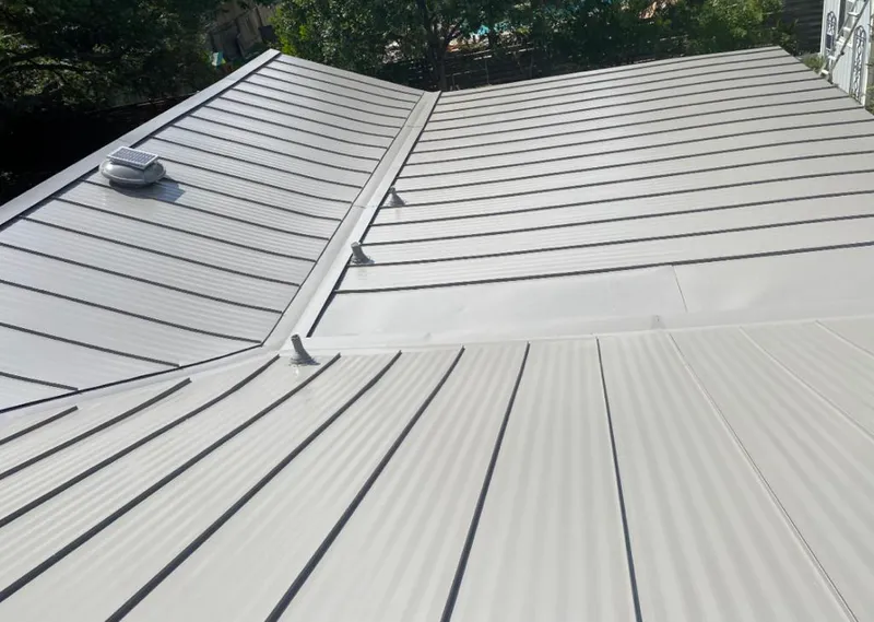 Solar attic fan installed on a metal roof for Roof Ventilation in North Merritt Island